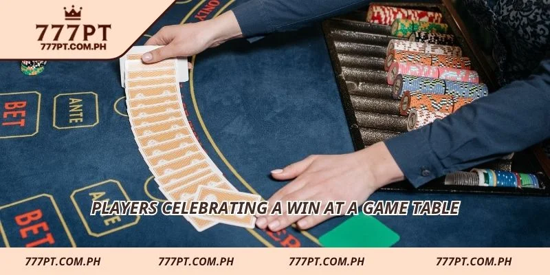 Players celebrating a win at a game table